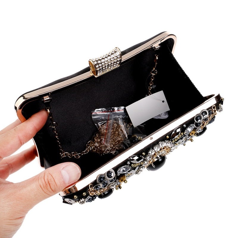 Elegant small black beaded clutch purse with metal chain strap, perfect for evening events and weddings.