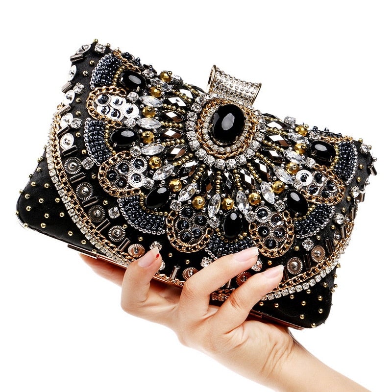 Elegant small black beaded clutch purse with metal chain strap, perfect for evening events and weddings.