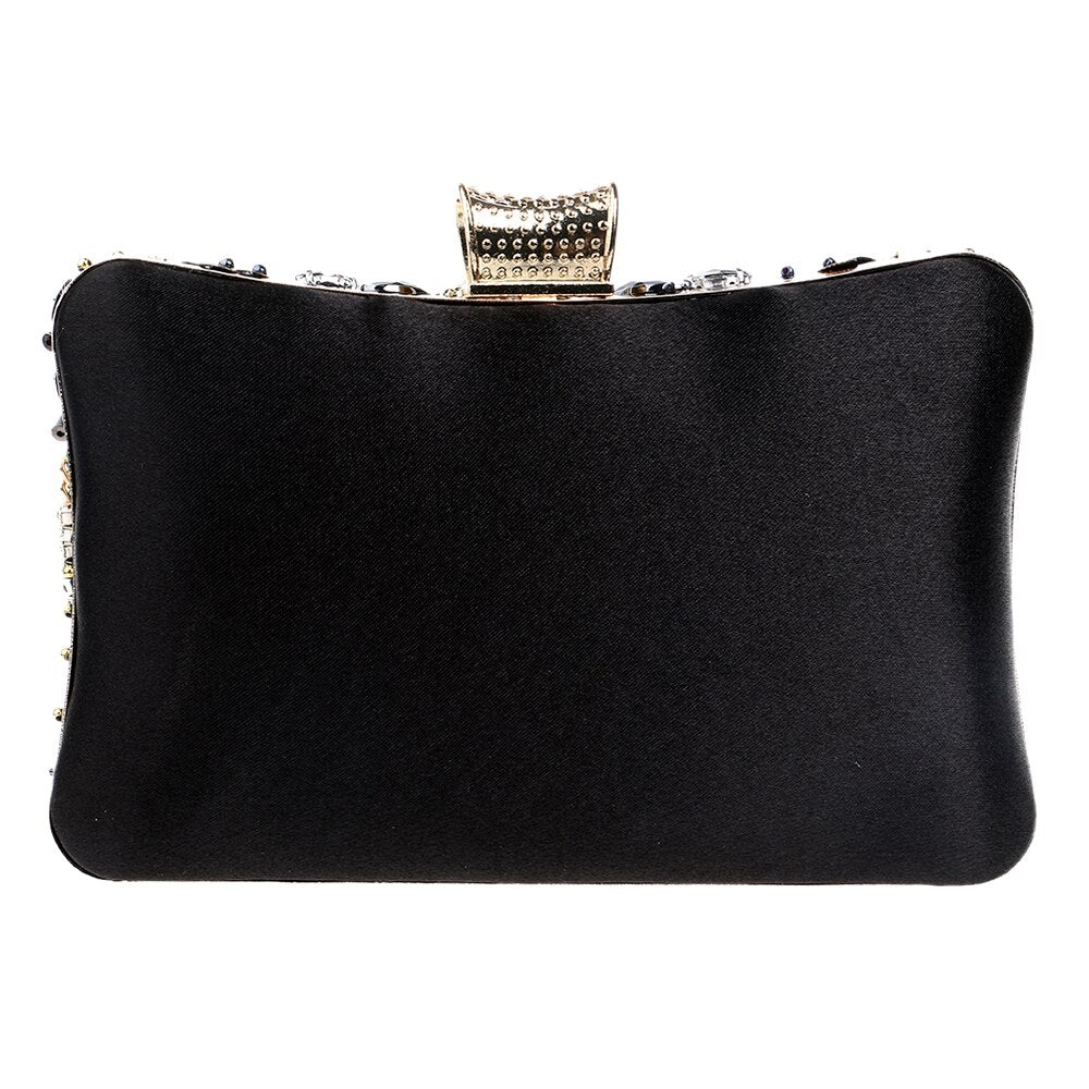 Elegant small black beaded clutch purse with metal chain strap, perfect for evening events and weddings.