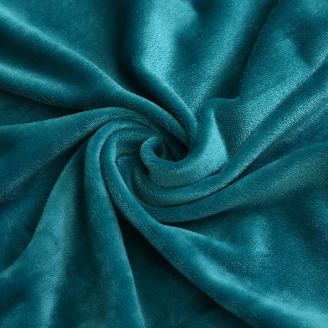 High stretch super soft plush sofa cover in green, designed to protect and enhance comfort.