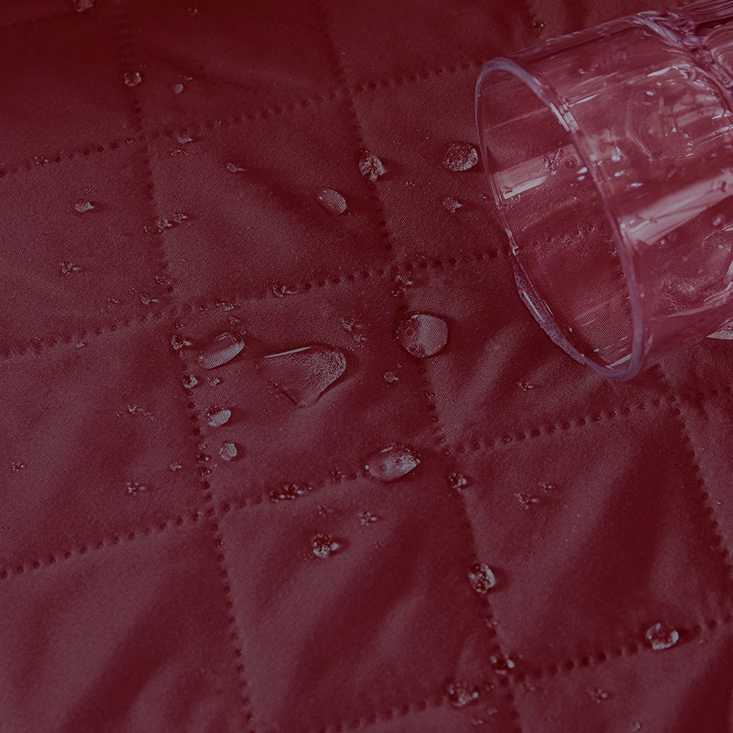 Beige quilted sofa cover protector, waterproof and stylish, designed for comfort and durability.