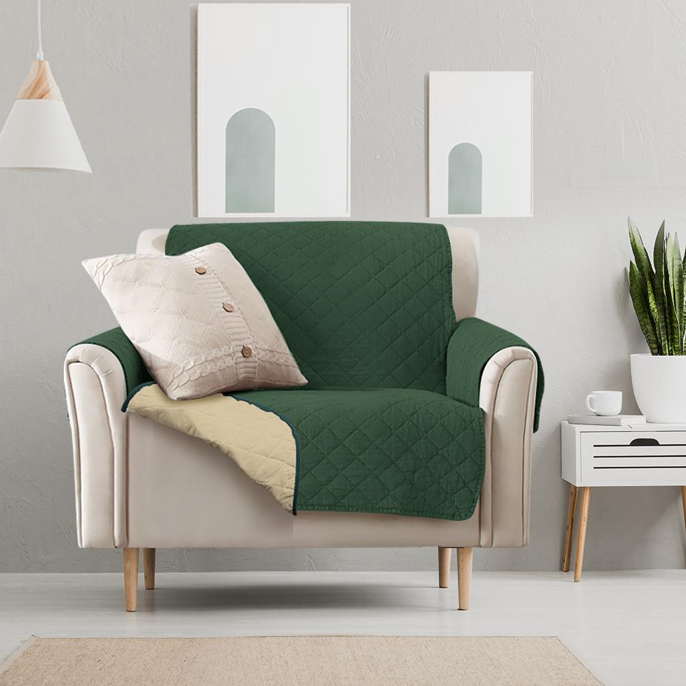 Waterproof quilted sofa cover in coffee color, designed for protection and style, featuring delicate edges and anti-slip backing.