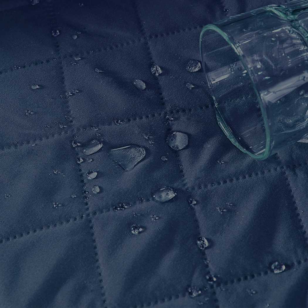 Teal quilted sofa cover protector, showcasing elegant design and waterproof features, perfect for home use.