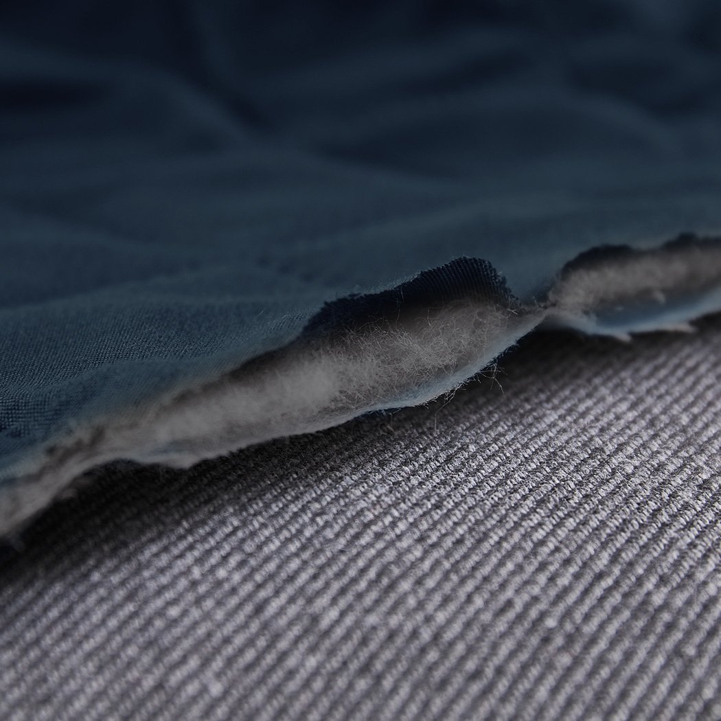 Teal quilted sofa cover protector, showcasing elegant design and waterproof features, perfect for home use.