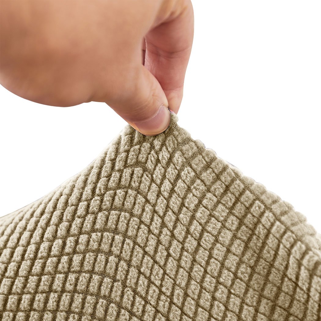 Stretchable sofa cover recliner chair protector in sand color, designed for durability and easy maintenance.