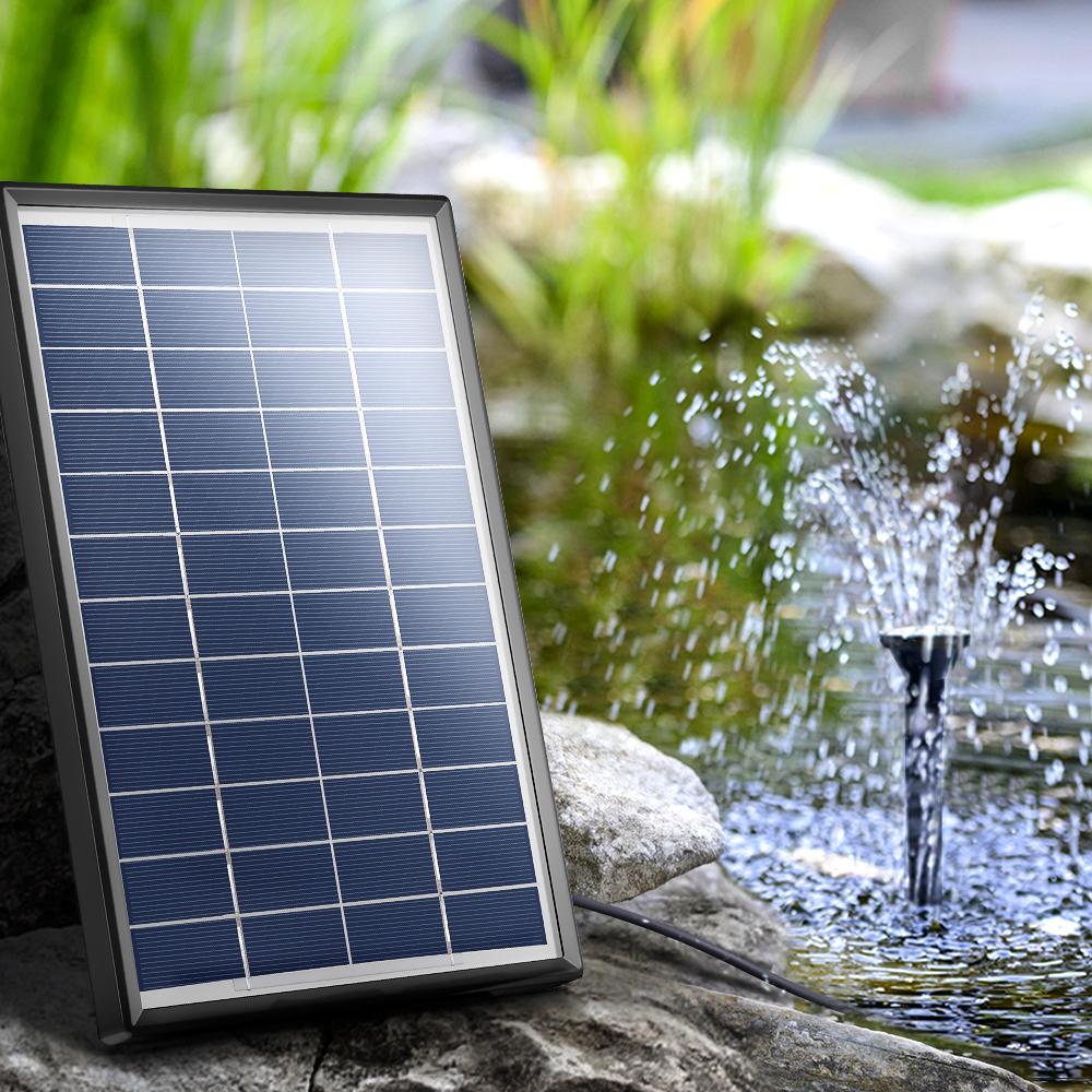 Solar Pond Pump Kit with solar panel and water pump for garden bird bath, showcasing a beautiful water display.