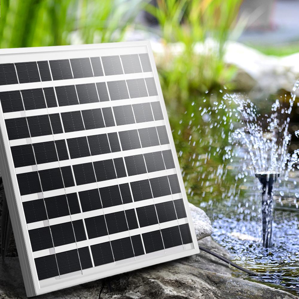 Solar Pond Pump with large solar panel and water fountain display in a garden setting, showcasing its elegant design and functionality.