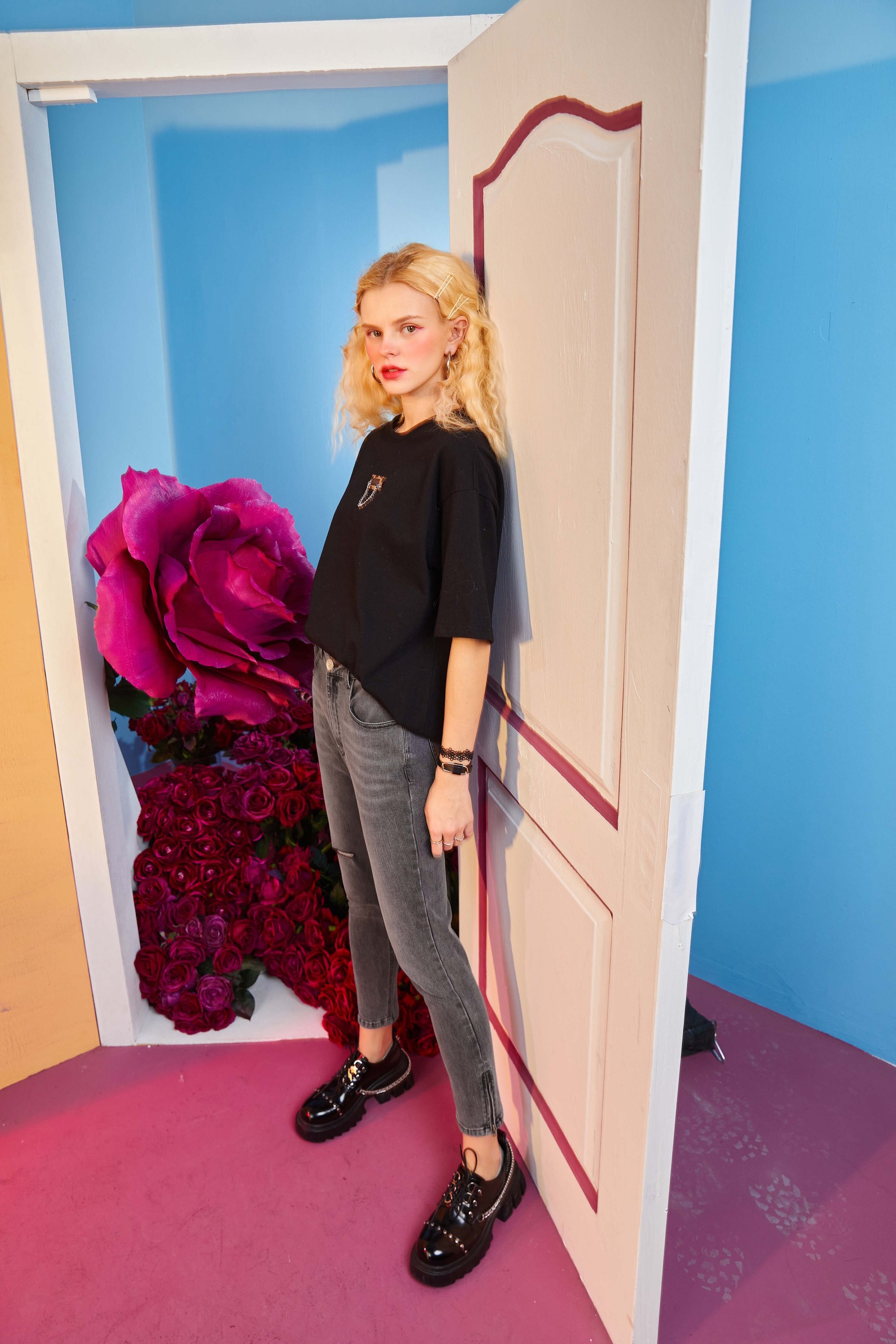 Solid high waist washed casual denim jeans for women, featuring a chic ripped hole design, available in blue and black.