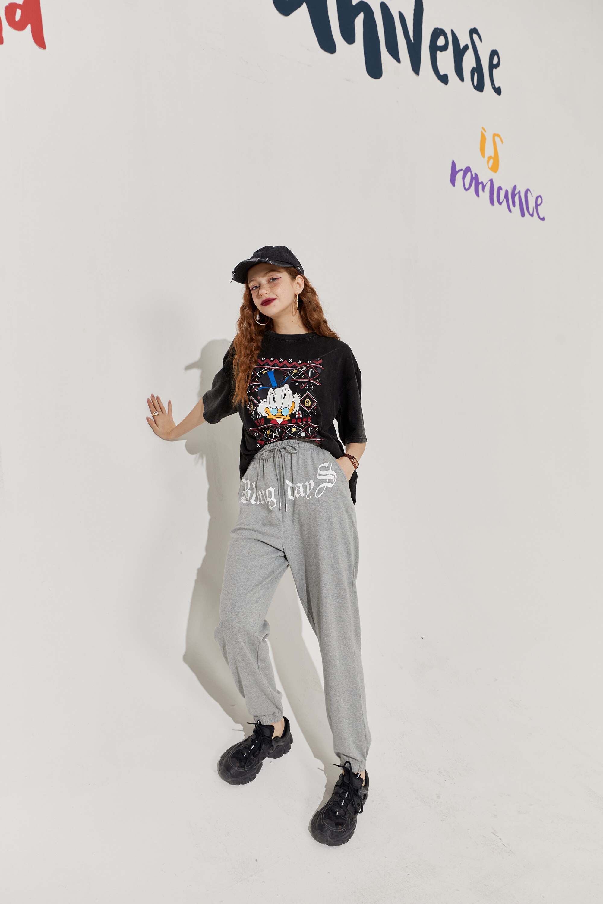 Solid Letter High Waist Straight Casual Women Harem Trouser in a stylish autumn setting, showcasing its high waist and comfortable fit.