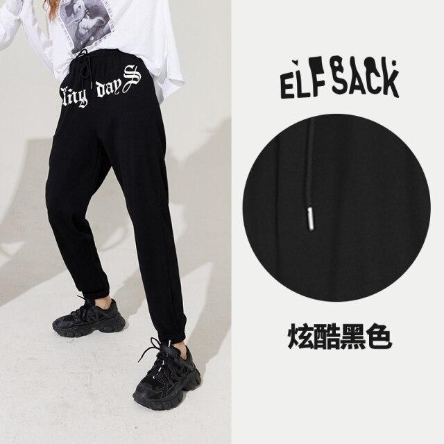 Solid Letter High Waist Straight Casual Women Harem Trouser in a stylish autumn setting, showcasing its high waist and comfortable fit.