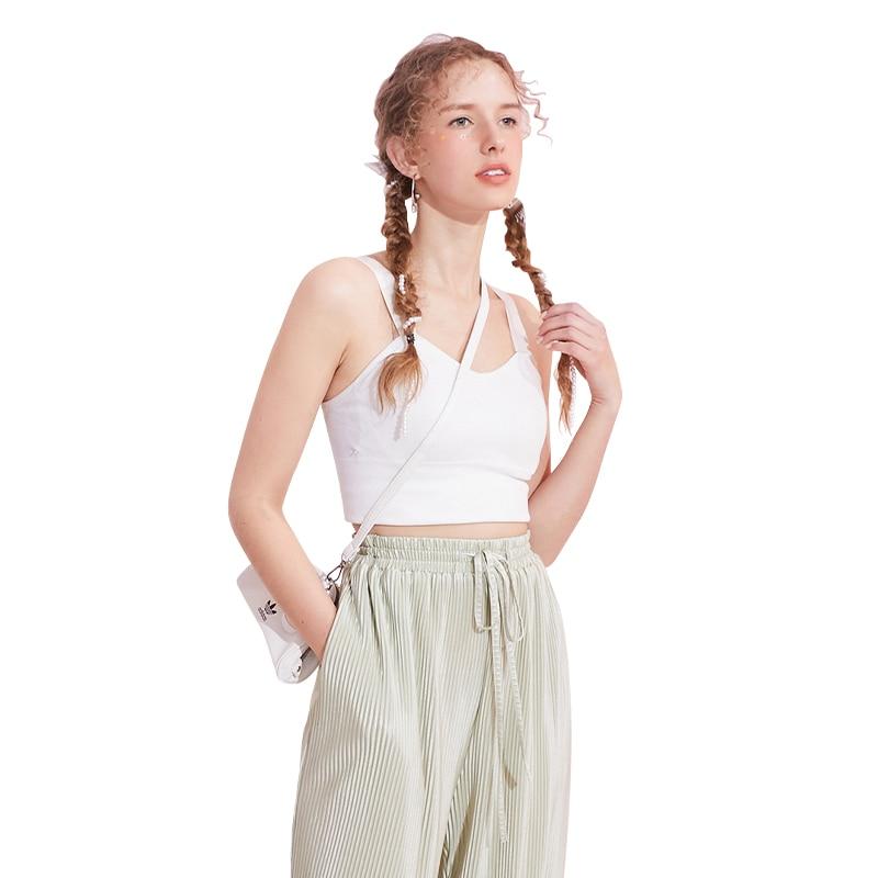 A stylish black and white crop top for women, featuring a minimalist design and sleeveless cut, perfect for casual spring outfits.