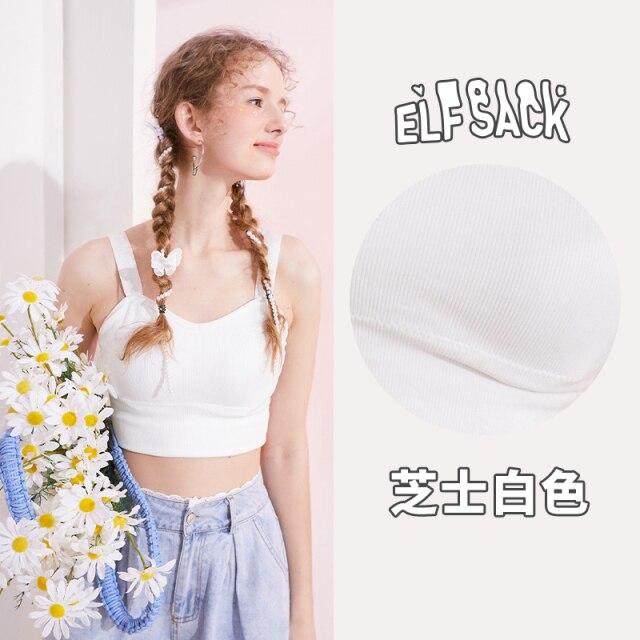 A stylish black and white crop top for women, featuring a minimalist design and sleeveless cut, perfect for casual spring outfits.