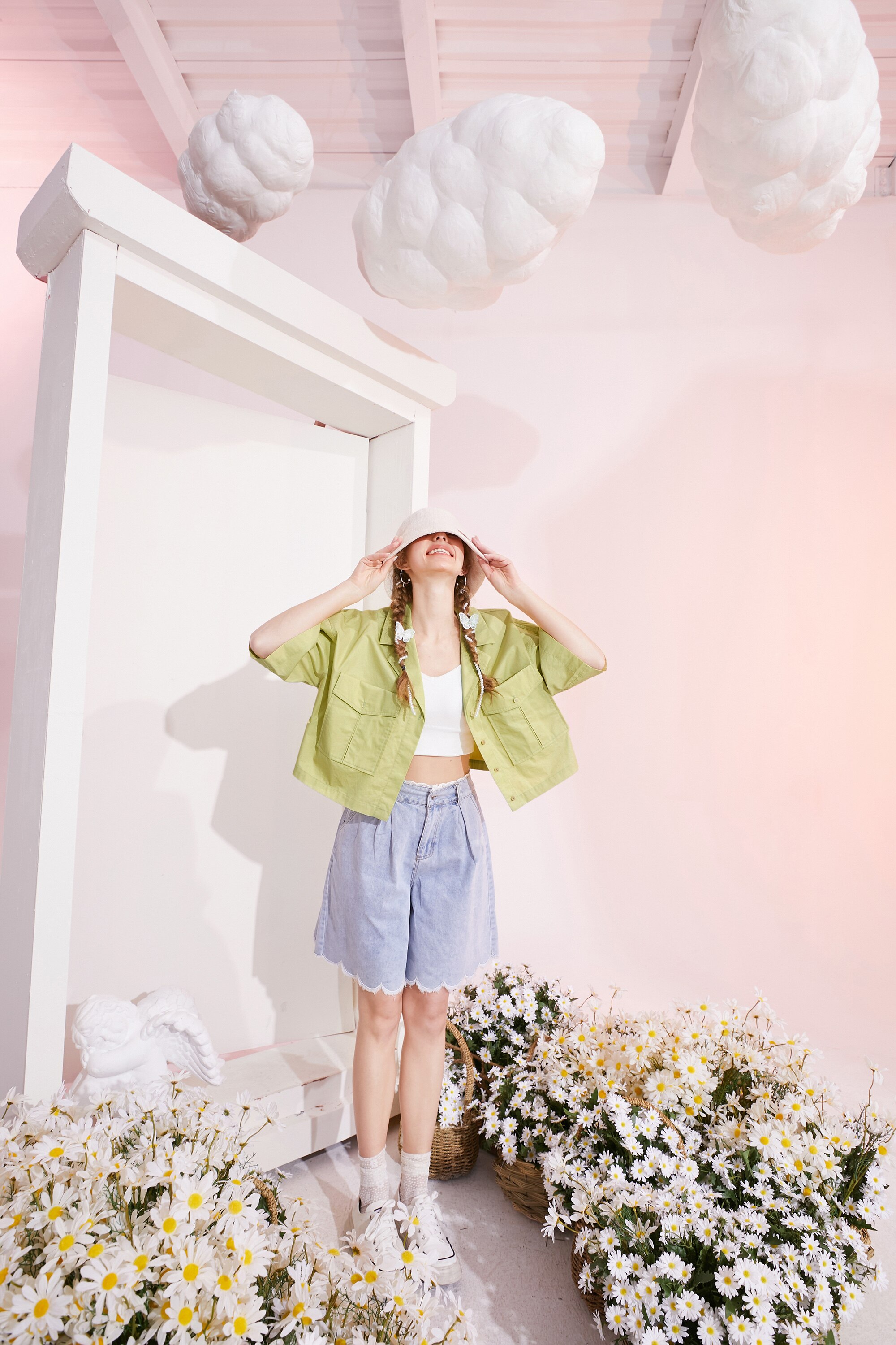 A stylish black and white crop top for women, featuring a minimalist design and sleeveless cut, perfect for casual spring outfits.