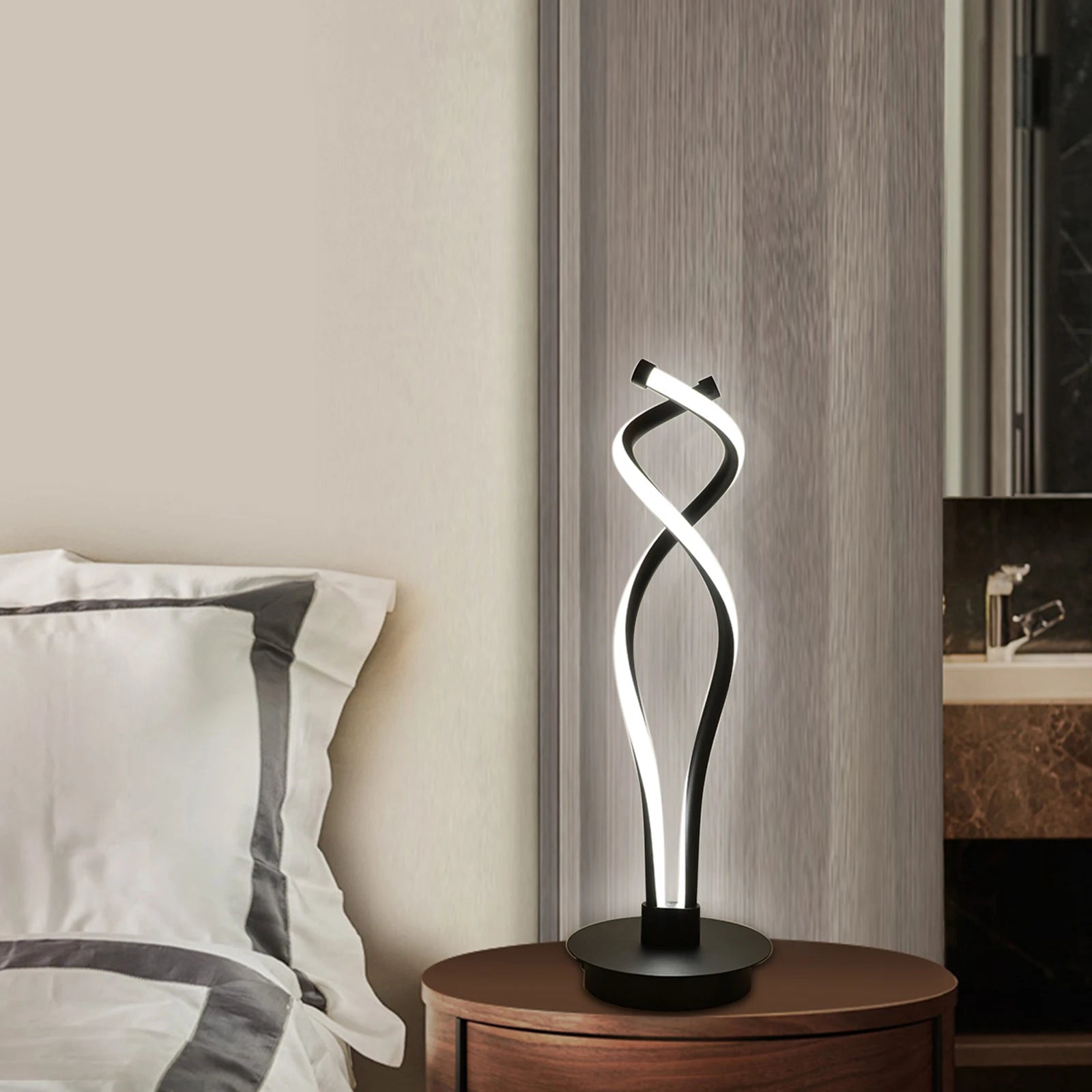 Modern Minimalist LED Spiral Table Lamp with a sleek black finish, designed for bedside or desk use, showcasing its unique spiral shape.