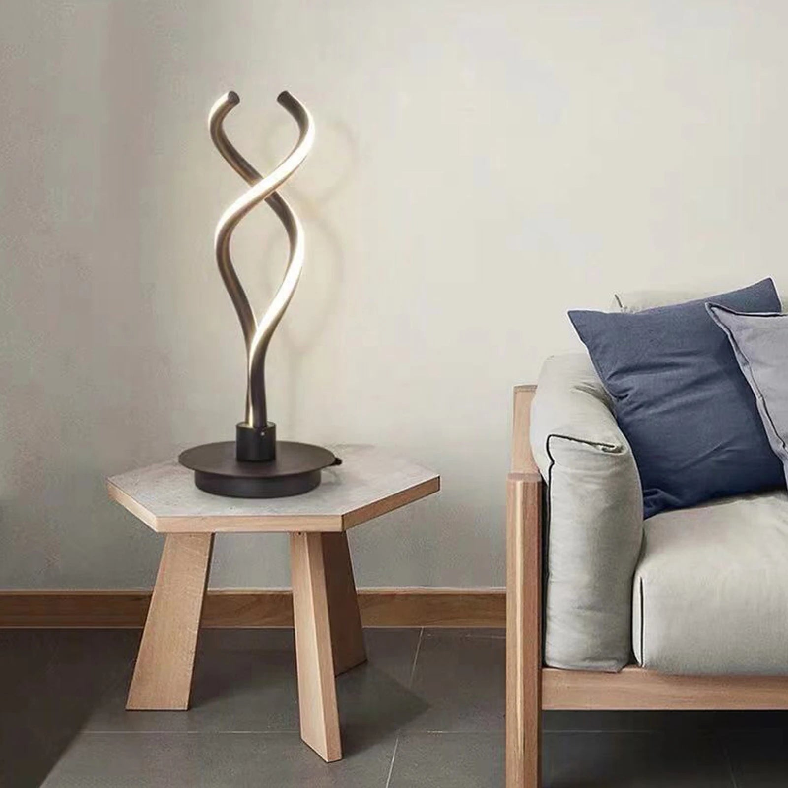Modern Minimalist LED Spiral Table Lamp with a sleek black finish, designed for bedside or desk use, showcasing its unique spiral shape.