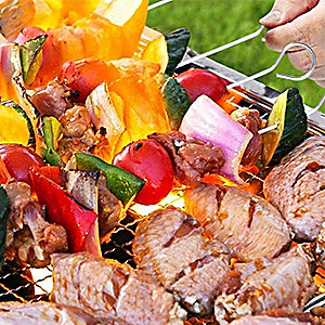 A complete set of stainless steel BBQ tools including spatula, tongs, fork, and skewers, neatly organized in a portable handbag.