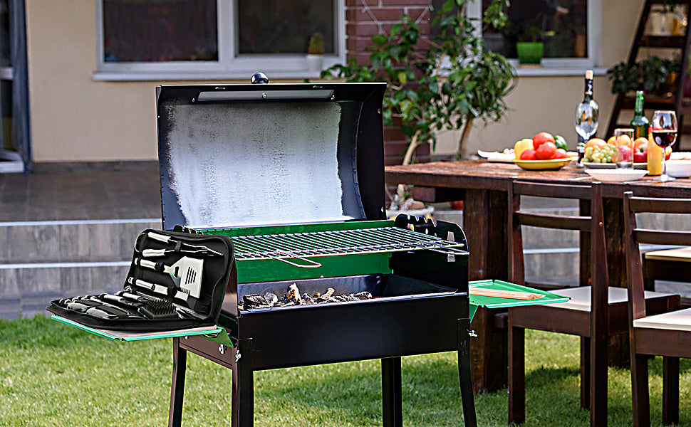 A complete set of stainless steel BBQ tools including spatula, tongs, fork, and skewers, neatly organized in a portable handbag.