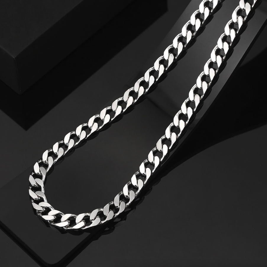 Stainless Steel Gold Silver Chain Cuban Curb Necklace displayed elegantly, showcasing its shiny links and durable clasp.