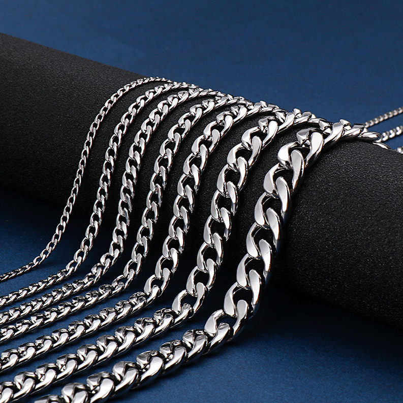 Stainless Steel Gold Silver Chain Cuban Curb Necklace displayed elegantly, showcasing its shiny links and durable clasp.