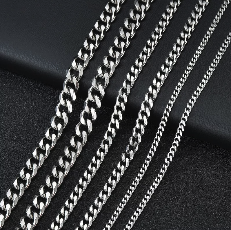 Stainless Steel Gold Silver Chain Cuban Curb Necklace displayed elegantly, showcasing its shiny links and durable clasp.