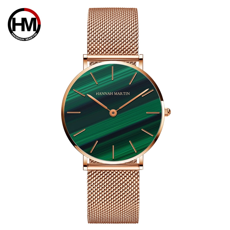 Elegant women's wristwatch with a green malachite stone dial and stainless steel mesh band, showcasing luxury and style.