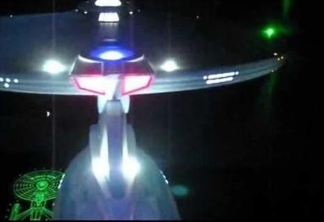 Star Trek USS Enterprise Refit model kit with lighting and sound effects, showcasing intricate details and vibrant LED lights.