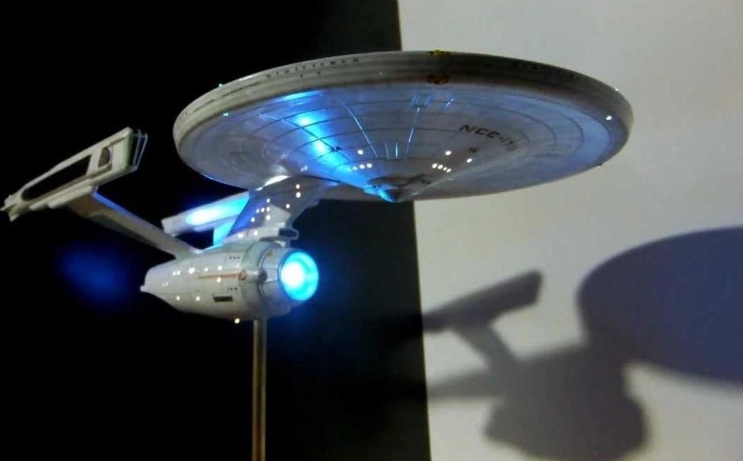 Star Trek USS Enterprise Refit model kit with lighting and sound effects, showcasing intricate details and vibrant LED lights.