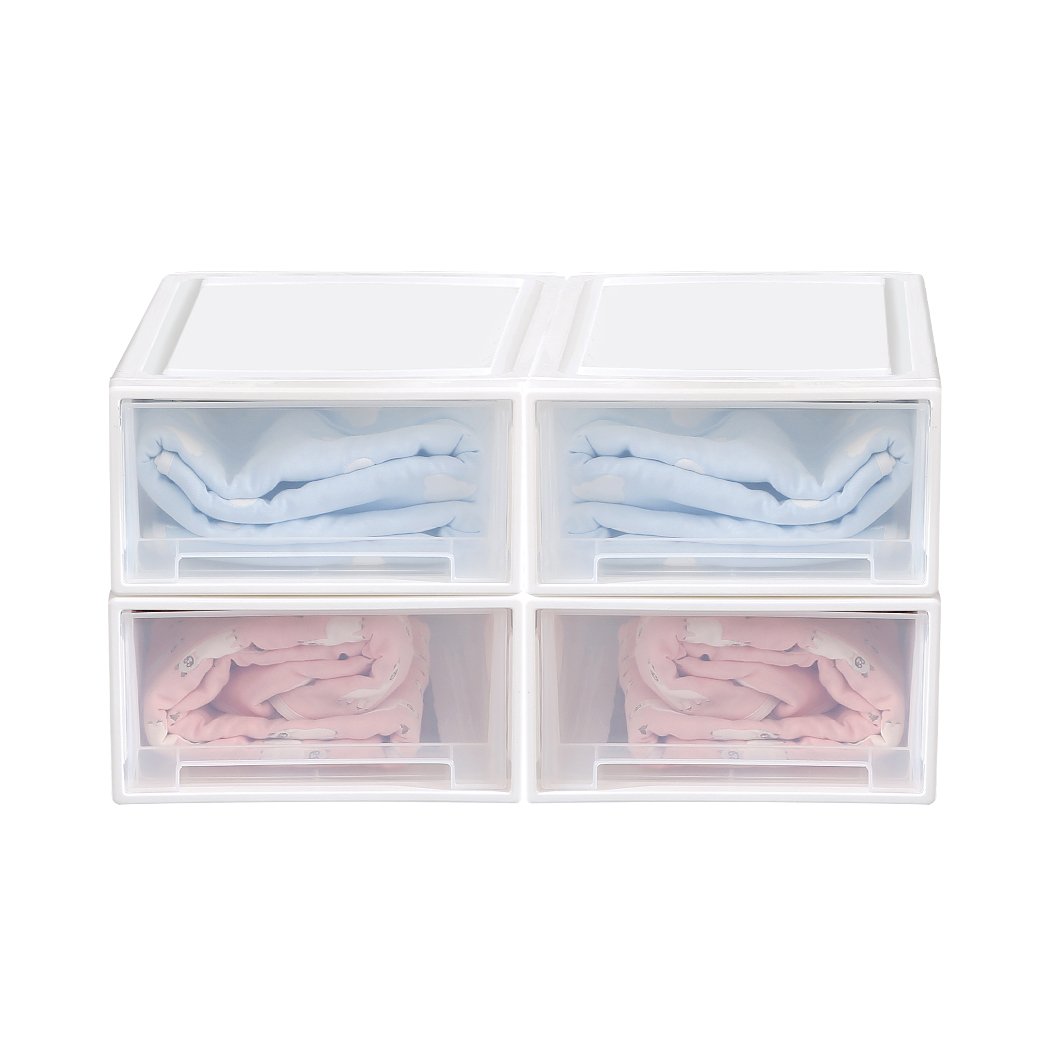 A set of four transparent storage drawers stacked together, showcasing their sleek design and integrated handles for easy access.