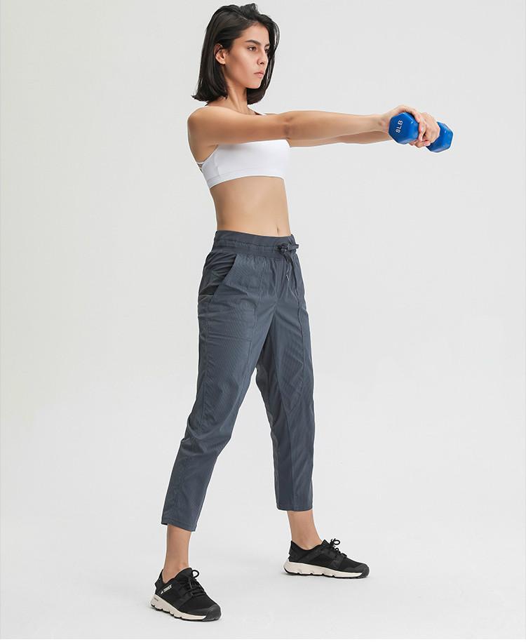 Women wearing STRIPE Mid Waist Drawstring Sport Gym Joggers, showcasing a stylish and comfortable fit for workouts.