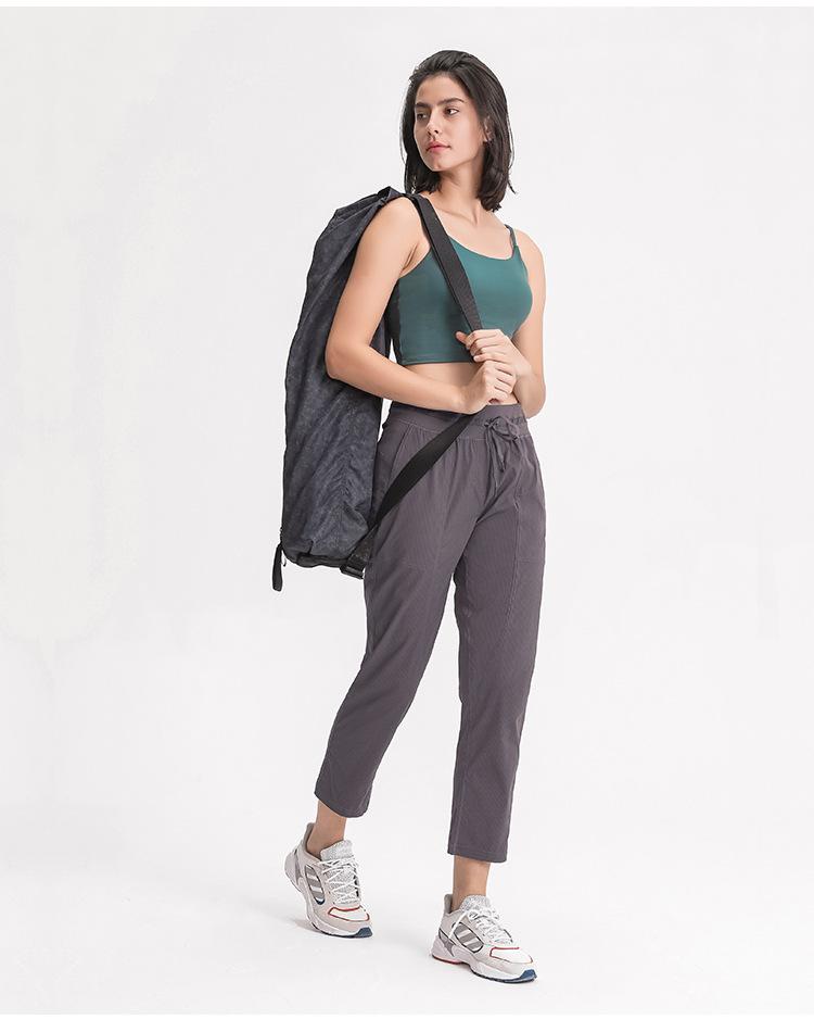Women wearing STRIPE Mid Waist Drawstring Sport Gym Joggers, showcasing a stylish and comfortable fit for workouts.