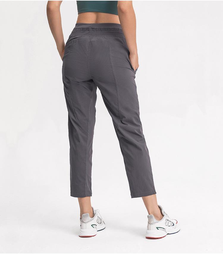 Women wearing STRIPE Mid Waist Drawstring Sport Gym Joggers, showcasing a stylish and comfortable fit for workouts.