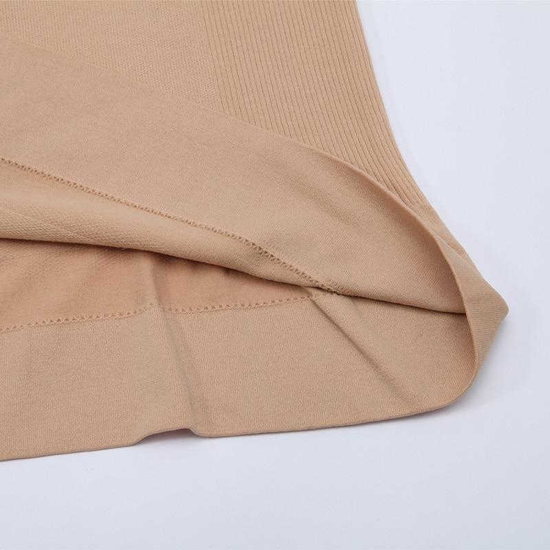 A stylish black tank top for women featuring a built-in padded shelf bra and wide straps, perfect for casual wear and active lifestyles.