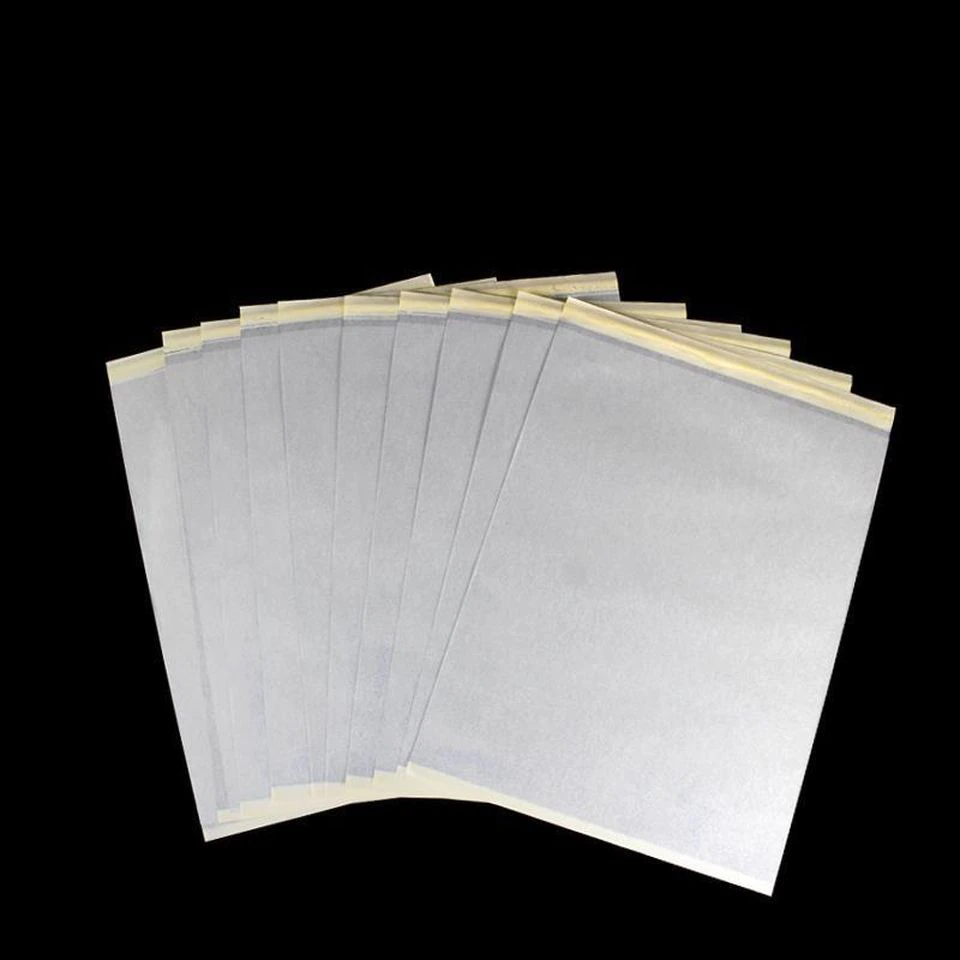 Tattoo Transfer Paper Stencil Carbon Thermal Tracing Hectograph Supplies Sheets displayed on a white background, showcasing its layers and size.