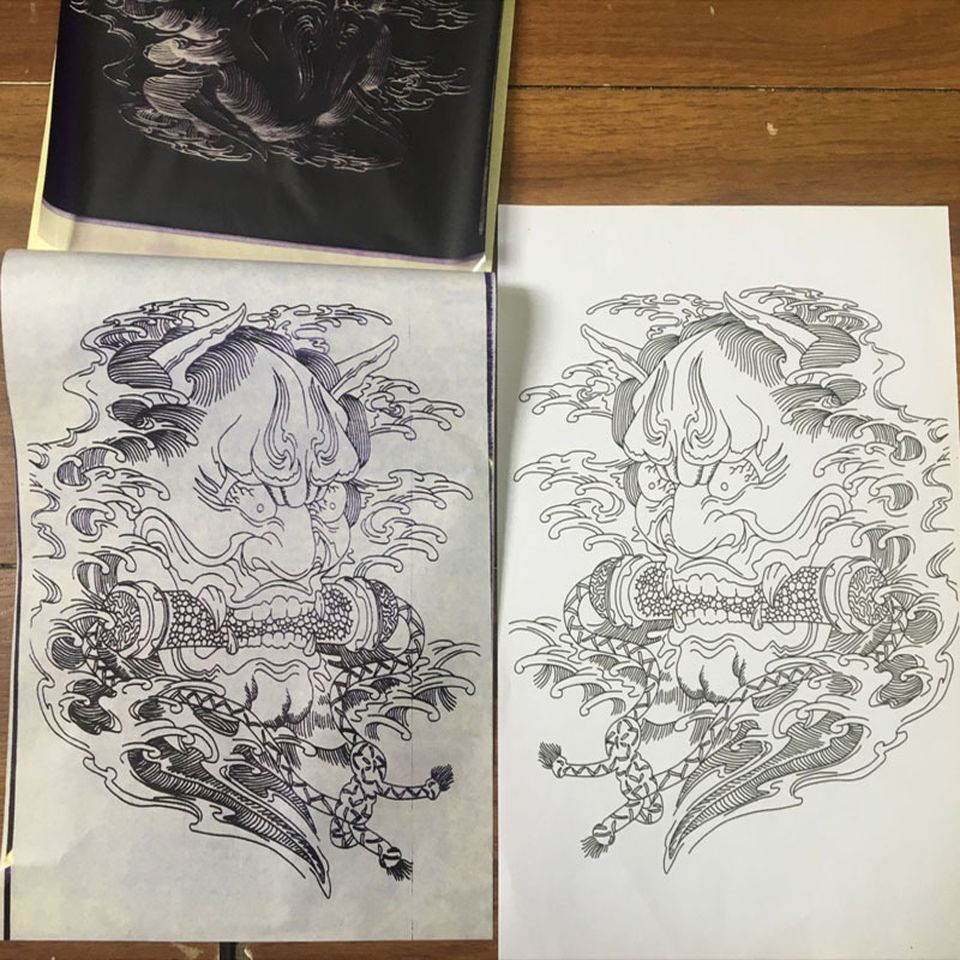 Tattoo Transfer Paper Stencil Carbon Thermal Tracing Hectograph Supplies Sheets displayed on a white background, showcasing its layers and size.