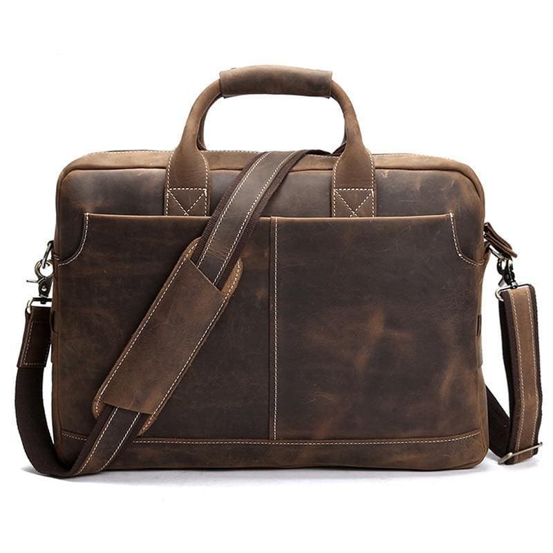 The Welch Briefcase, a vintage leather messenger bag, showcasing high-quality crazy horse leather with adjustable straps and a stylish design.