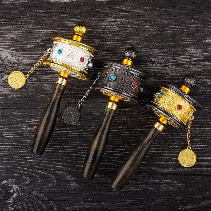 Tibetan Special Crafts Prayer Wheel made of alloy metal, featuring intricate carvings and available in gold, silver, and copper colors.