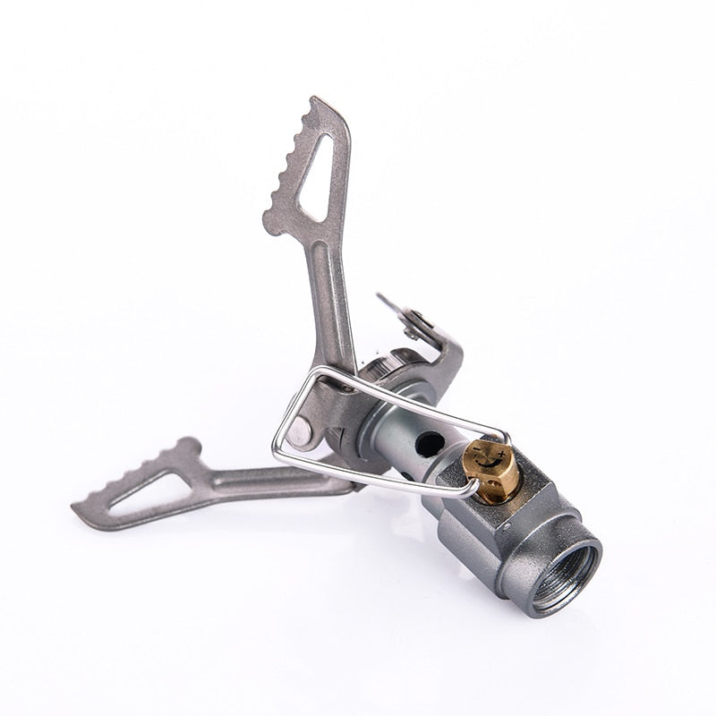 A compact Titanium Mini Gas Burner camping stove, showcasing its lightweight design and portable features, ideal for outdoor cooking.