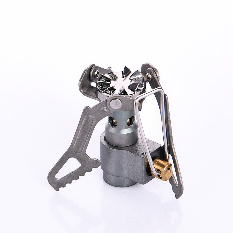 A compact Titanium Mini Gas Burner camping stove, showcasing its lightweight design and portable features, ideal for outdoor cooking.