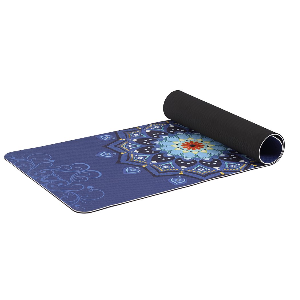 Eco-friendly TPE yoga mat with dual layer and non-slip surface, featuring traditional design and bonus carry bag for easy transport.
