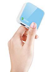 TP-LINK TL-WR702N N150 Wireless N Nano Router in a compact size, showcasing its micro USB port and LAN port.