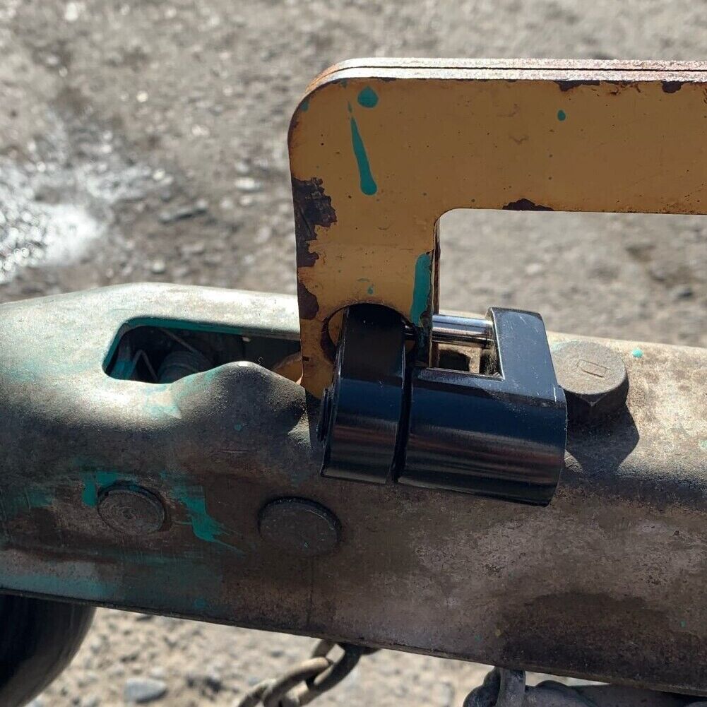 Trailer Hitch Coupler Lock with 1/4 inch diameter and 3/4 inch span, designed for securing trailers, boats, RVs, and trucks, featuring two keys.