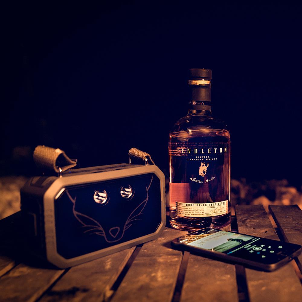 Traveller Outdoor Bluetooth V4.0 Speaker in a rugged outdoor setting, showcasing its waterproof design and portable features.