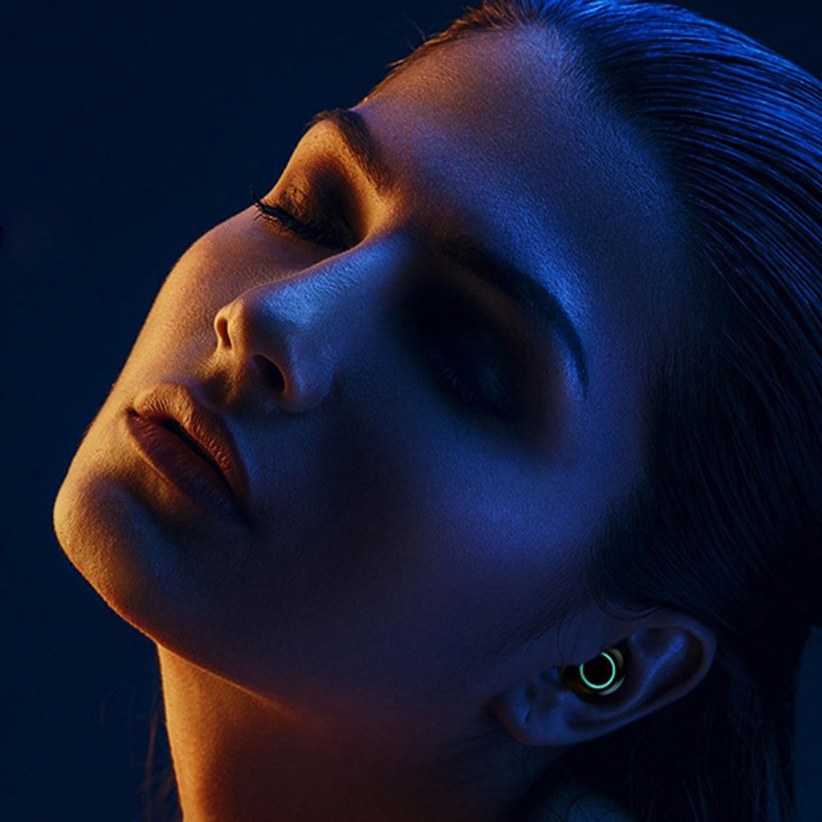 True Twin 2 In 1 Wireless Headphones with Phone Charger featuring a sleek design and golden rim, showcasing its dual functionality.