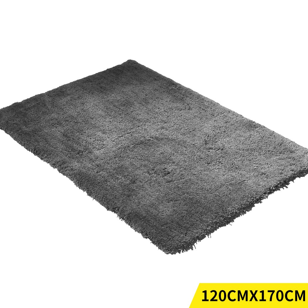Ultra Soft Anti Slip Rectangle Plush Shaggy Floor Rug in a cozy living room setting, showcasing its thick pile and non-slip backing.