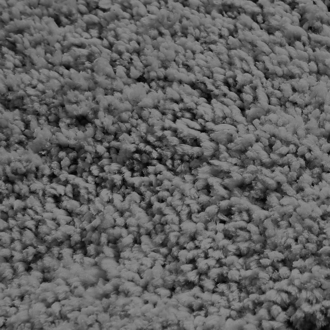 Ultra Soft Anti Slip Rectangle Plush Shaggy Floor Rug in a cozy living room setting, showcasing its thick pile and non-slip backing.