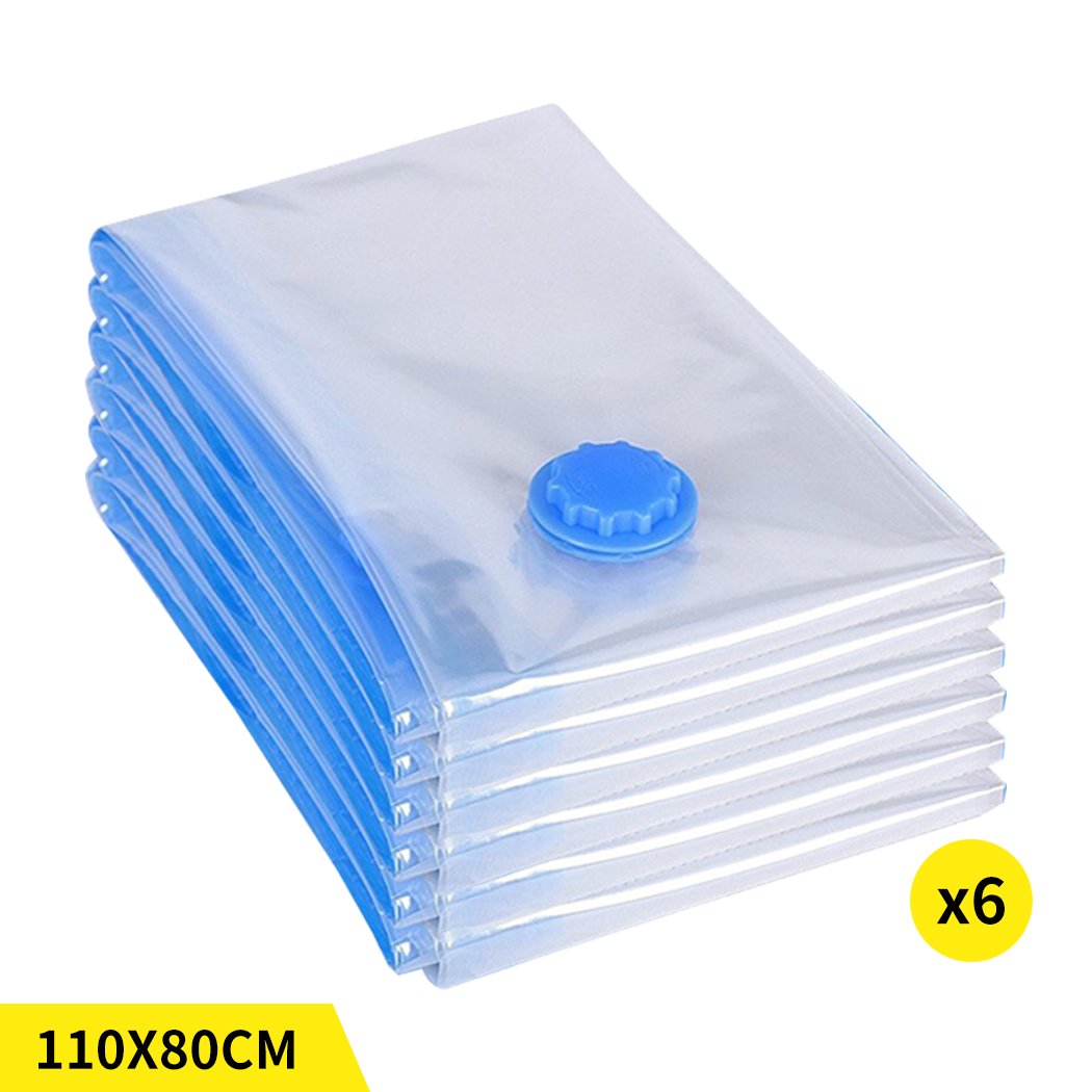 A set of six transparent vacuum storage bags filled with various clothing items, showcasing their space-saving design and airtight seal.