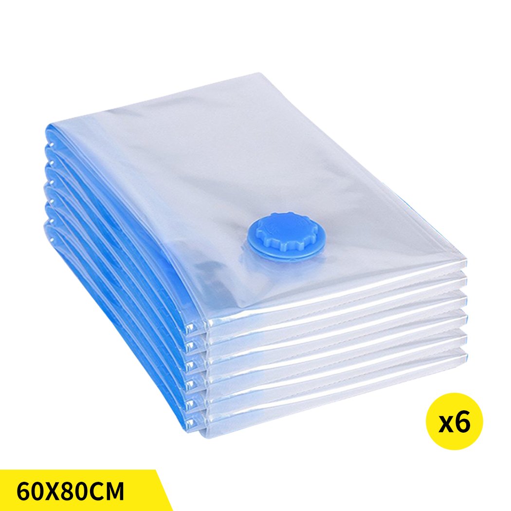 A set of six transparent vacuum storage bags filled with clothes and quilts, showcasing their space-saving design and airtight seal.