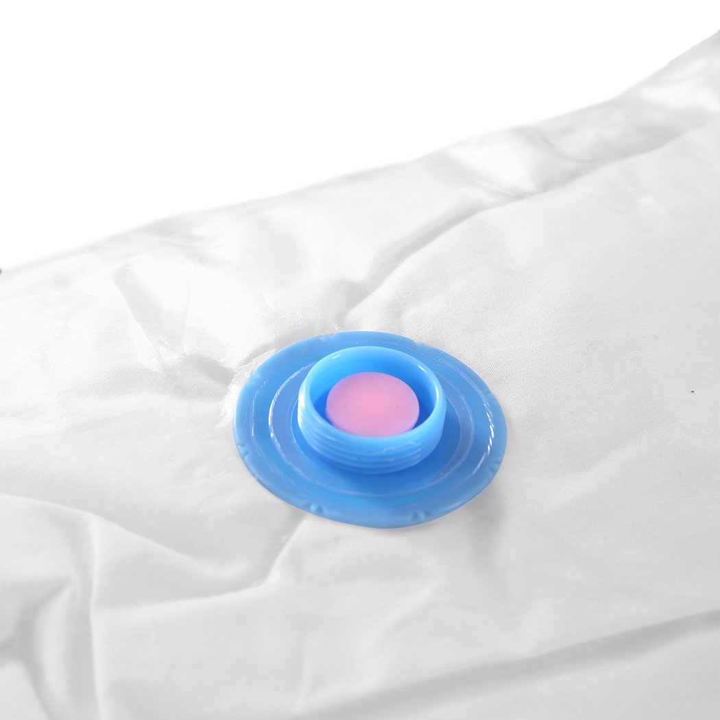 A set of six transparent vacuum storage bags filled with clothes and quilts, showcasing their space-saving design and airtight seal.
