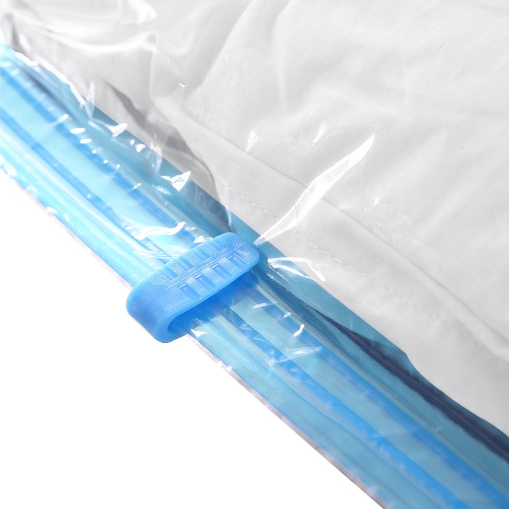 A set of transparent vacuum storage bags with an air pump, ideal for compressing clothes and quilts for space-saving storage.