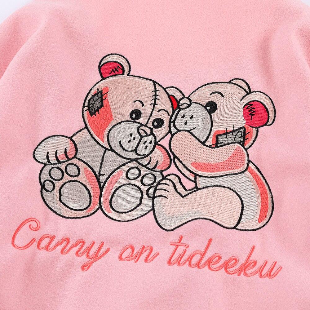 Men's varsity jacket featuring bear embroidery and patchwork design, perfect for autumn and winter wear.